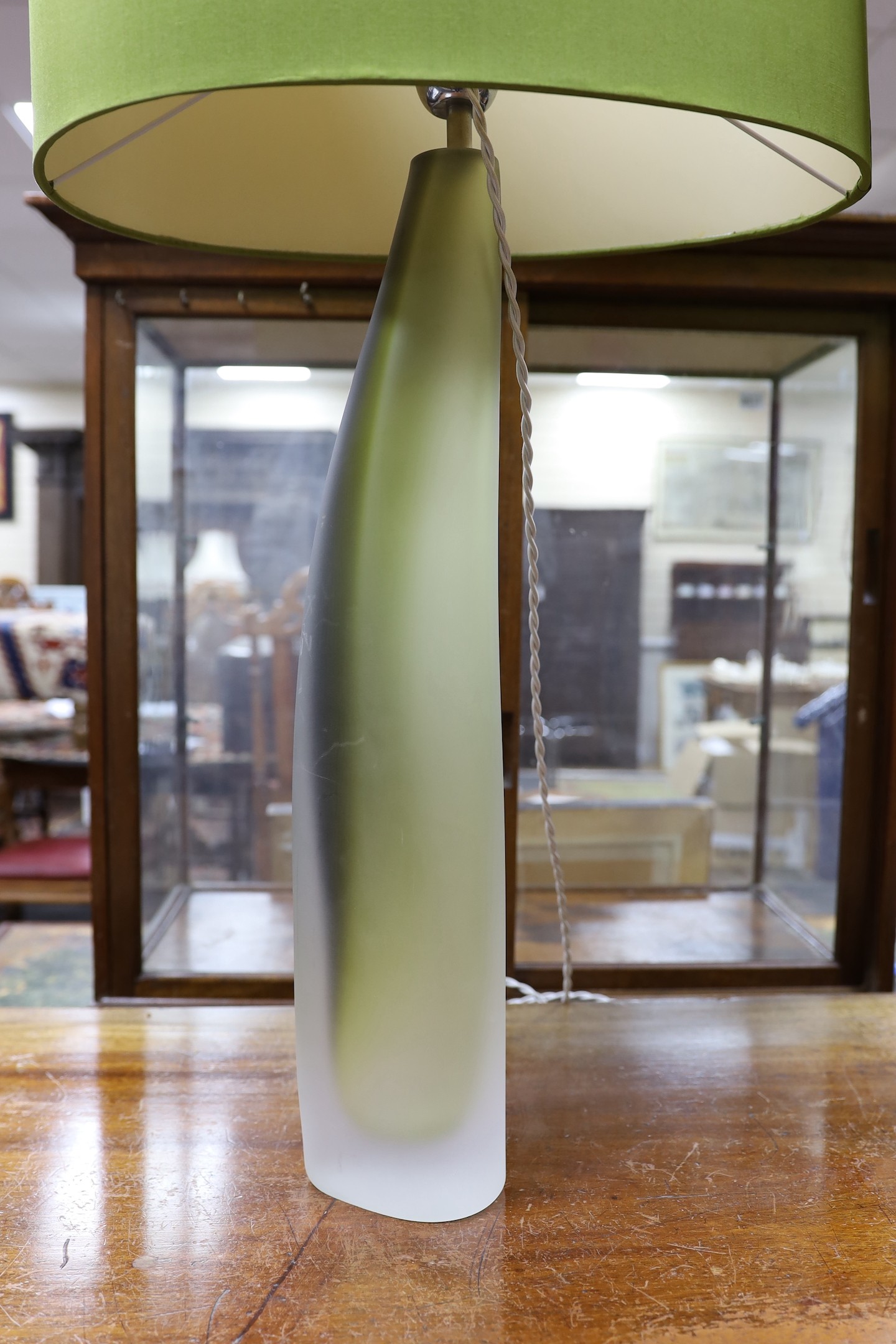 A pair contemporary green and opaque glass table lamps with shades, 90cm total height